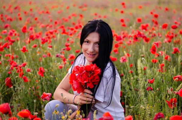 A young girl with dark long hair is wearing a blouse T-shirt and — Stock Photo, Image