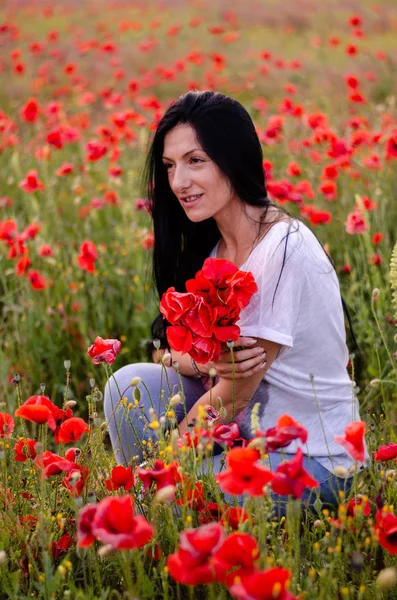 A young girl with dark long hair is wearing a blouse T-shirt and — Stock Photo, Image