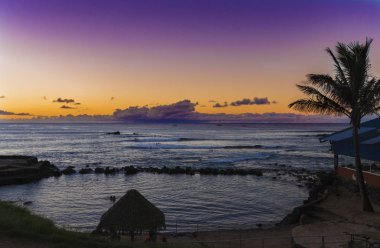 Sunset on the ocean at Hanga Roa clipart