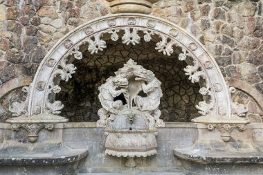 Sculpture in the Guardian Portal in the Quinta de Regaleira park clipart