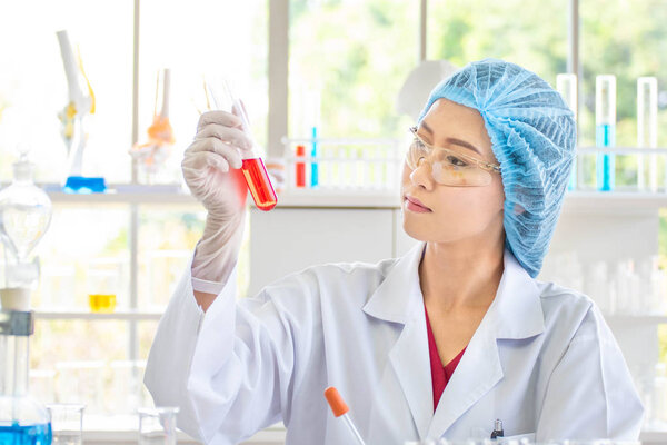 Scientists are testing chemicals.