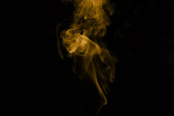 Siyah arka planda altın duman.