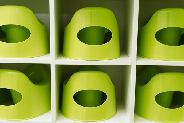 Green nursery pots in kindergarten. Children\'s toilet