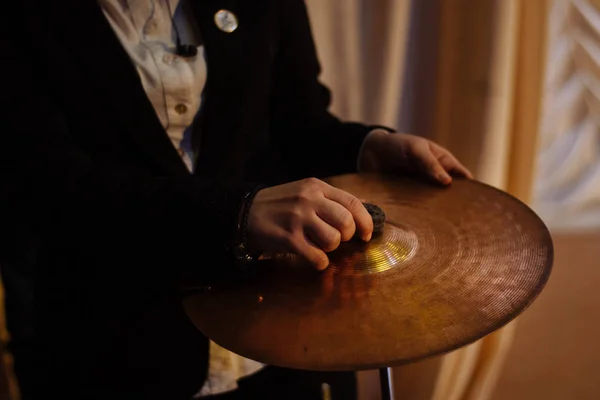 drum kit. man sets up a drum set. drum disk.