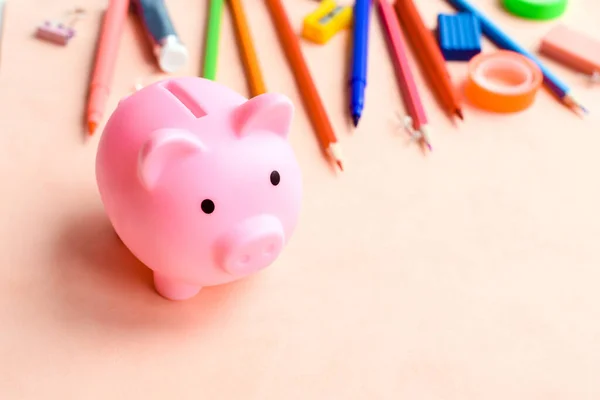 Office Supplies Next Piggy Bank Pink Background Concept Accumulating Money — Stock Photo, Image