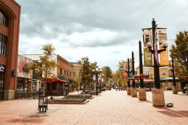 Boulder, Colorado - May 27th, 2020:  Shops, businesses and restaurants along Pearl Street Mall, a pedestrian mall in Boulder County.   clipart