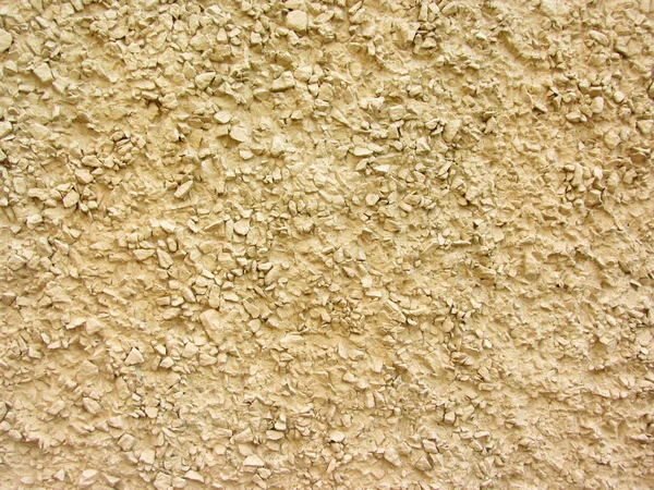 Parete decorata con piccolo macadam spruzzato, macerie, pietra frantumata, rocce rotte — Foto Stock