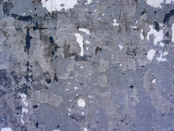 Πολυεπίπεδη τοίχος από τούβλα με πολλαπλά ίχνη επισκευής. Αποσύζευξη γύψος, κονίαμα, τσιμέντο. Χρωματιστό φόντο τοιχοποιίο. — Φωτογραφία Αρχείου
