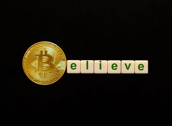 Word Believe made up of cubes. The first letter of the word is symbolized by a bitcoin coin. Concept of BTC investment, bitcoin growth rate, confidence, belief, positive price outlook. — 스톡 사진