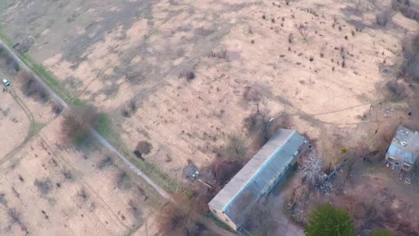 Flying over a field trail in a dry field — Stock Video