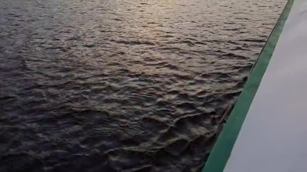 4K. The ship sails on the wide river Dnieper with large bridges before sunset — Stock Video
