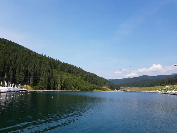 Historical lake in Carpathian mountains, Youth Lake in Bukovel. Ukraine.