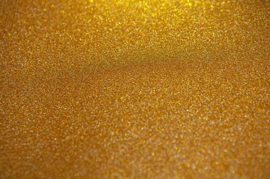 Çok sayıda renkli parlak şenlikli bokeh ile soyut altın bulanık arka plan. Yumuşak seçici odak. Metin için kopya alanı içeren doku. Kutlamalar, tatiller konsepti. Yatay.