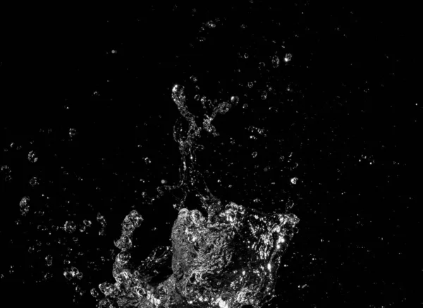 Salpicos de água isolados no fundo preto — Fotografia de Stock