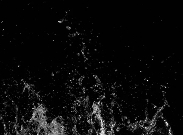 Wasserspritzer auf schwarzem Hintergrund — Stockfoto