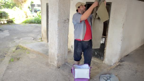 Nearby Garbage Room Homeless Man Carefully Looks Old Faded Pants — Stock Video