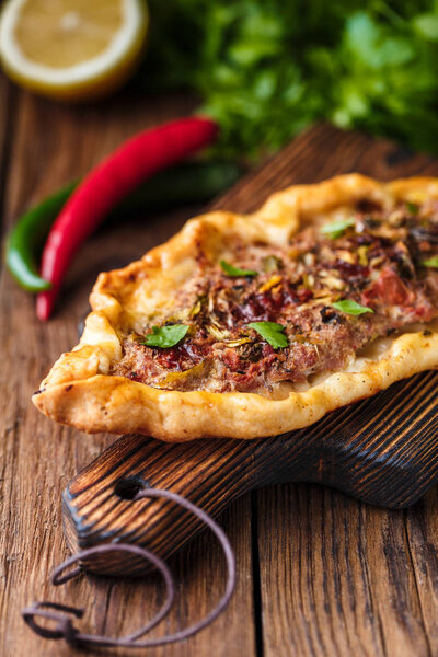 selective focus of Tasty Turkish pide on wooden table