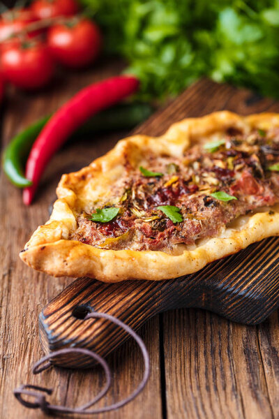 selective focus of Tasty Turkish pide on wooden table