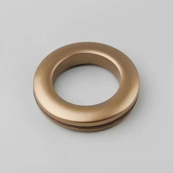 Circular curtain grommet ring for cornice fixing on grey background