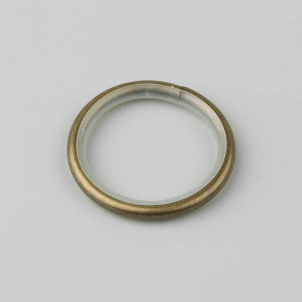Curtain metal ring for cornice pole on grey background