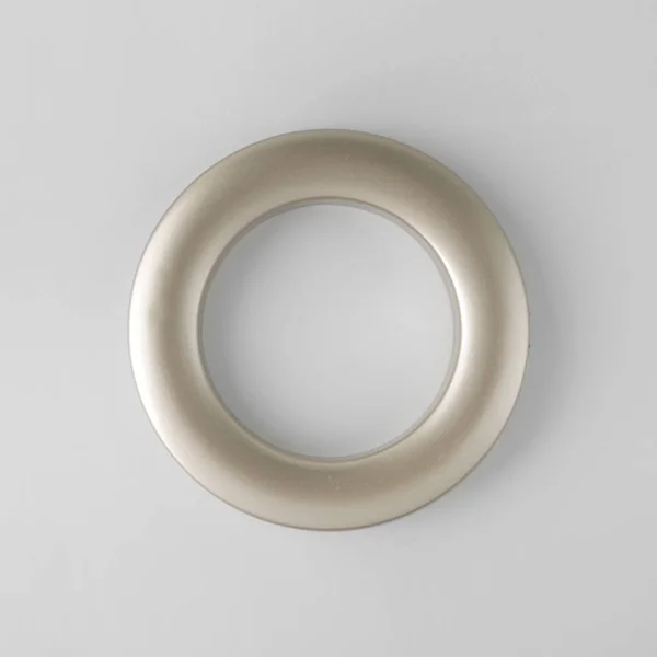 Circular curtain grommet ring for cornice fixing on grey background