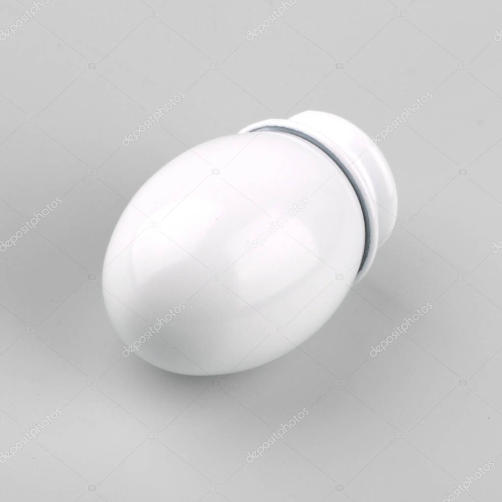 Egg-shaped white tip for curtain cornice on grey background