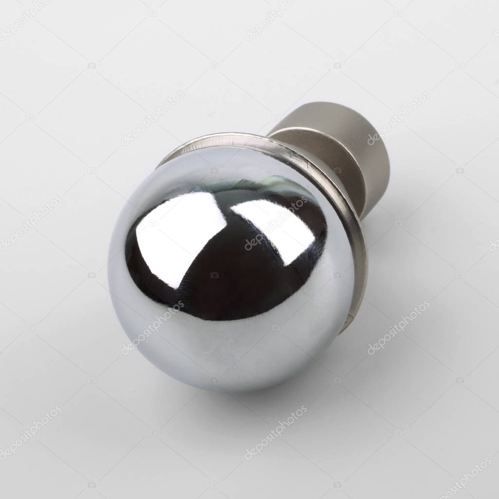 Round pearl-like modern metal finial for cornice on grey background
