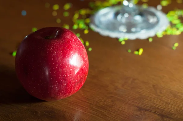red apple on wooden background in bar