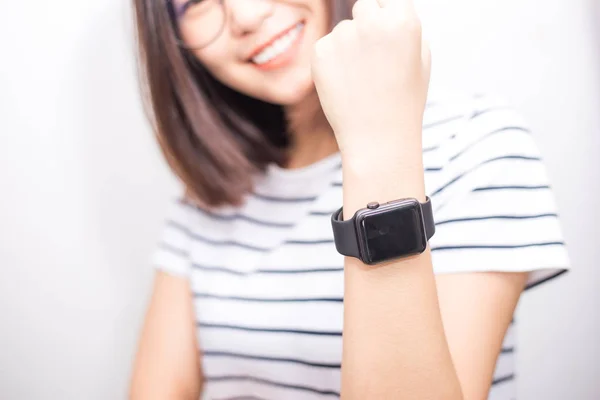 Beautiful asian women with smart watch on white background