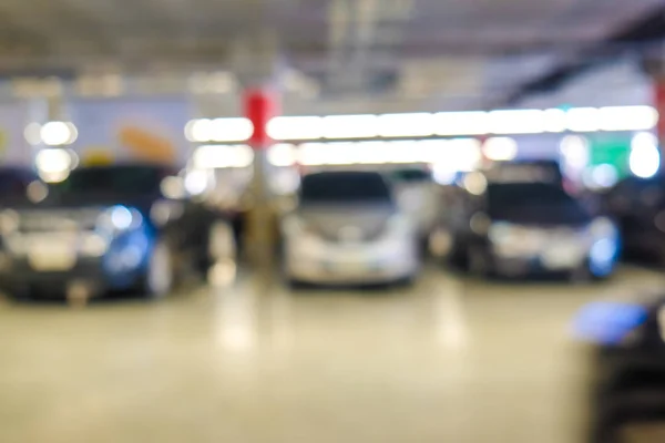 Blurred parking indoor of super store modern trade transport background