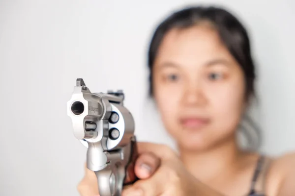 Women shooting target with .357 .44 magnum revolver gun on white background