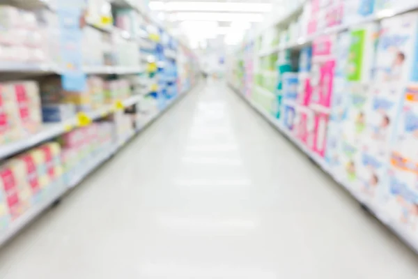 Blurred shelf in supermarket business background shopping concept