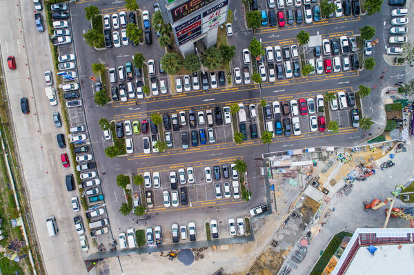 Aerial view many lot of car parking in row on concrete