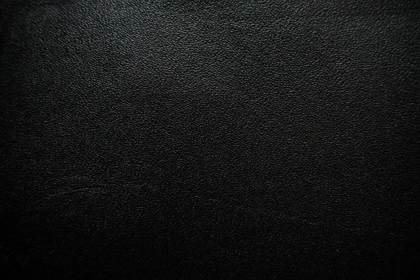 Настоящий черный кожаный фон — стоковое фото