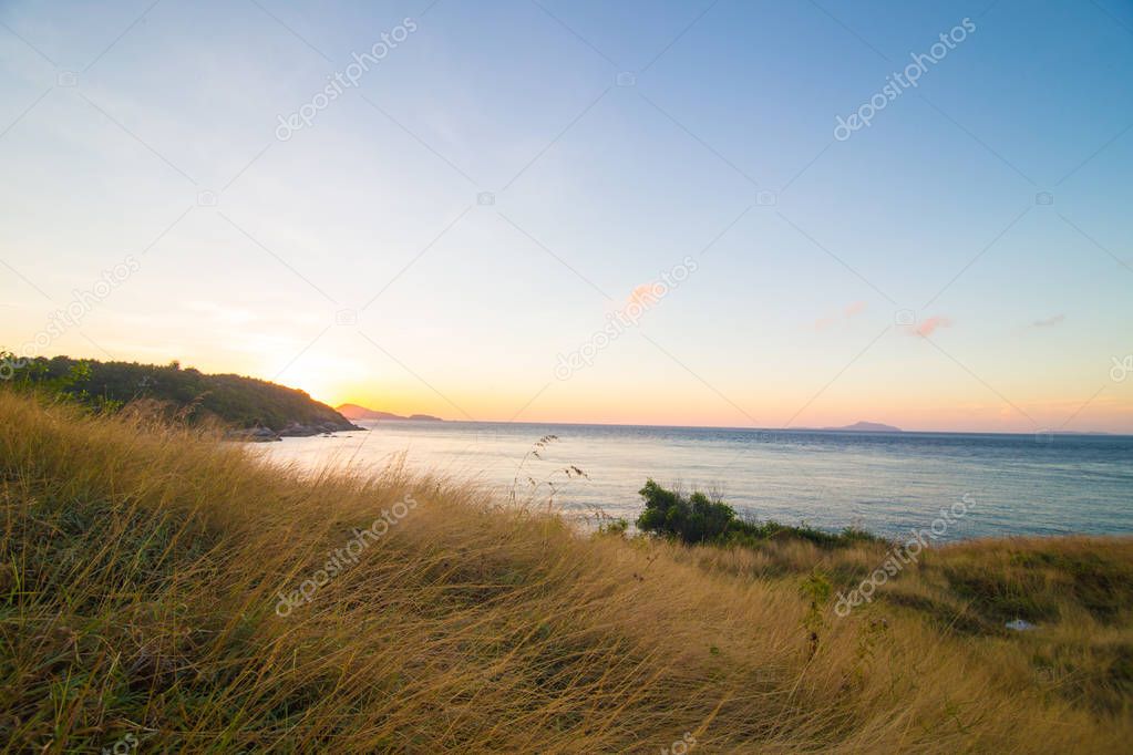 Sea coastline sunset island with colourful sky cloud