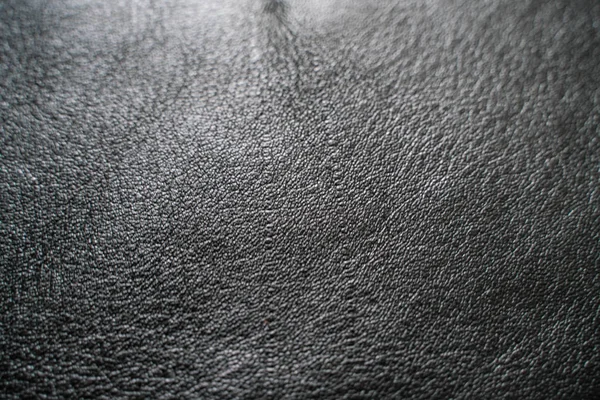 黑牛皮皮革纹理选择性焦点放产品 — 图库照片