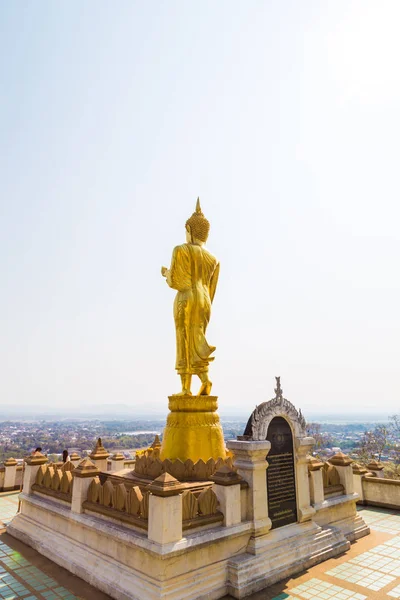 Golden buddhist statue on mountain in Nan — Stock Photo, Image