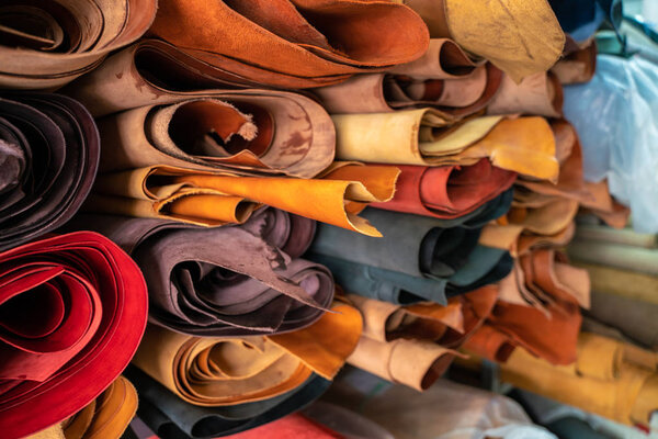 Tanned leather on shelf in craftsmanship market