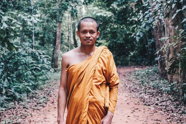Buddhist monk meditation in tropical forest