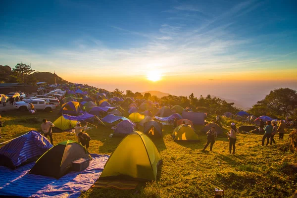 Tourist enjoying sunrise on mountain with camping — Stock Photo, Image