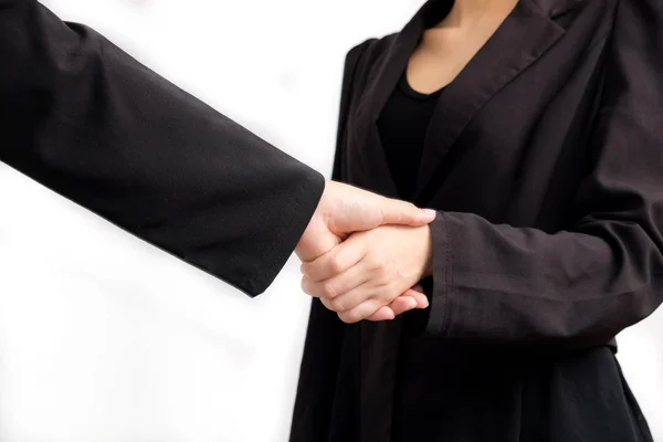 Business asian women shaking hand with partner job success