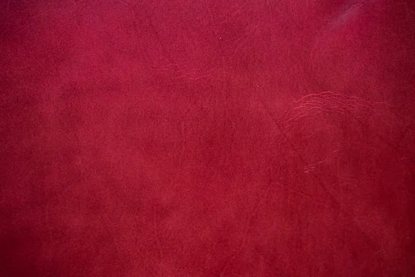 Abstrakter Hintergrund aus echtem rotem Cartier-Leder — Stockfoto