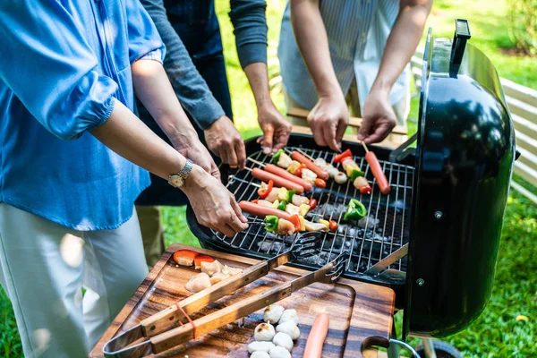 Party group of middle age with bbq grilled and drink — Stock Photo, Image