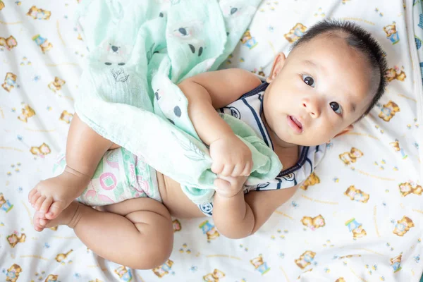 Adorable innocence baby boy lying on blanket — Stock Photo, Image