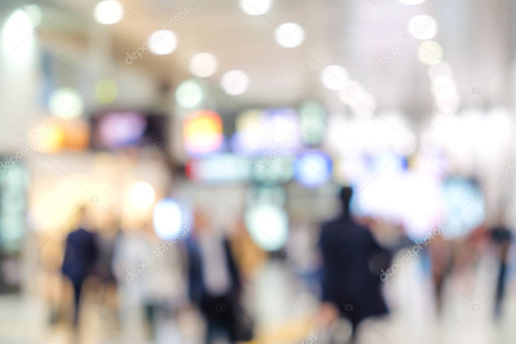 Blurred people in train station