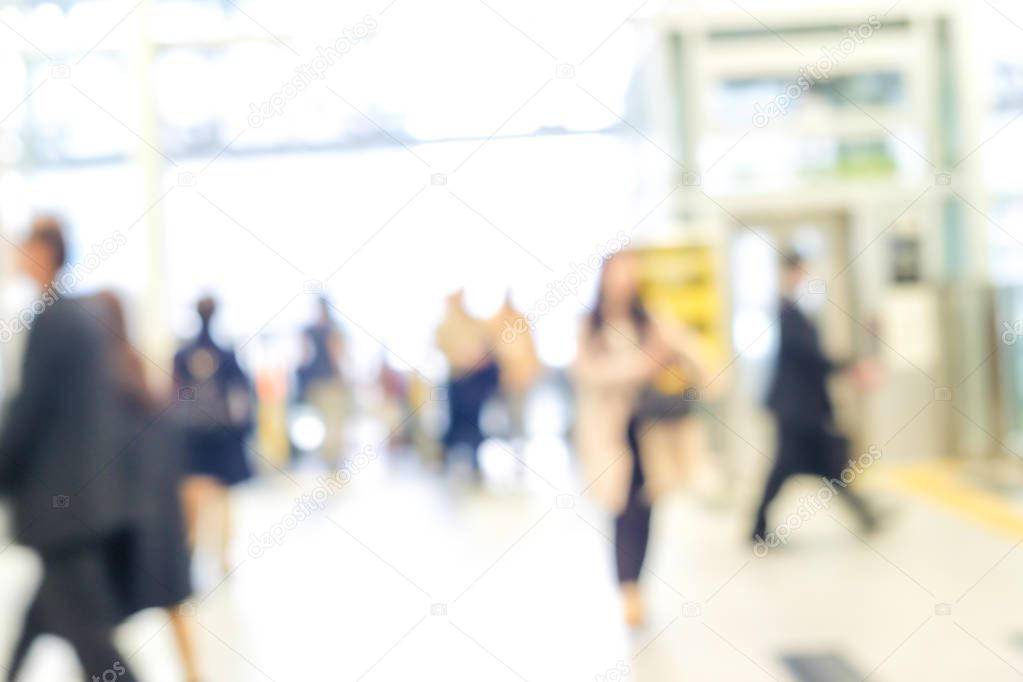 Blurred people in train station