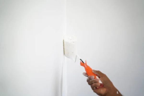 Hand of artist paint inside home renovate — Stock Photo, Image