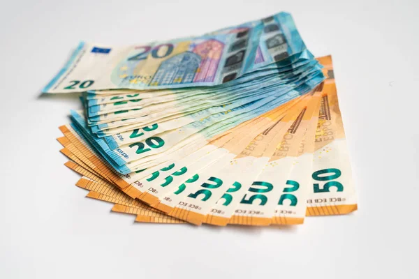 Куча денег евро на белом фоне — стоковое фото