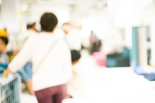 Blurred group of business people walking in shopping mall