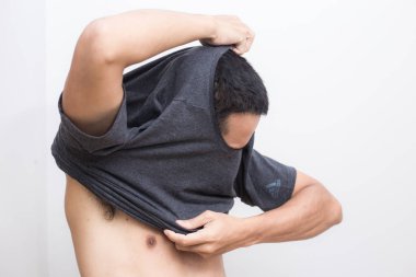 Asian men take off shirt